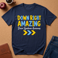 NAVY BLUE T-SHIRT SAYS 'DOWN RIGHT AMAZING, DOWN SYNDROME AWARENESS' IN LIGHT BLUE, YELLOW, AND WHITE PRINT.  