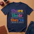 Navy Blue T-shirt Says There (Are people who don't listen to) Teir (teacher's grammer lessons, and) They're (DRIVING me CRAZY)