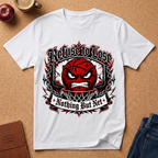 A white short-sleeve graphic T-shirt laid flat on a cork background, featuring a red basketball face with an angry expression, chains, and the text 'Refuse to Lose' and 'Nothing But Net'. Surrounding props include a red apple, a coffee cup, a brown journal, and blue jeans.