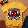 A yellow graphic t-shirt laid flat on a cork background with lifestyle props including an apple, a coffee mug, a notebook, and jeans. The t-shirt features a red basketball with an angry face, surrounded by chains and the gothic text 'Refuse to Lose' and 'Nothing But Net'.