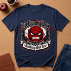 A navy blue graphic t-shirt laid flat on a brown cork background, surrounded by lifestyle props including an apple, a coffee mug, a leather journal, and blue jeans. The t-shirt features a graphic of a red angry basketball inside a basketball hoop, with the gothic text 'Refuse to Lose' above and 'Nothing But Net' below.