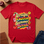 A red short-sleeve graphic T-shirt laid flat on a cork surface, surrounded by styled props including an apple, a mug, a notebook, and blue jeans. The shirt features a colorful retro-style chest graphic reading 'Straight Outta Summer Break' with rainbow, smiley face, lightning bolt, notebook, pencil, apple, and bow details.
