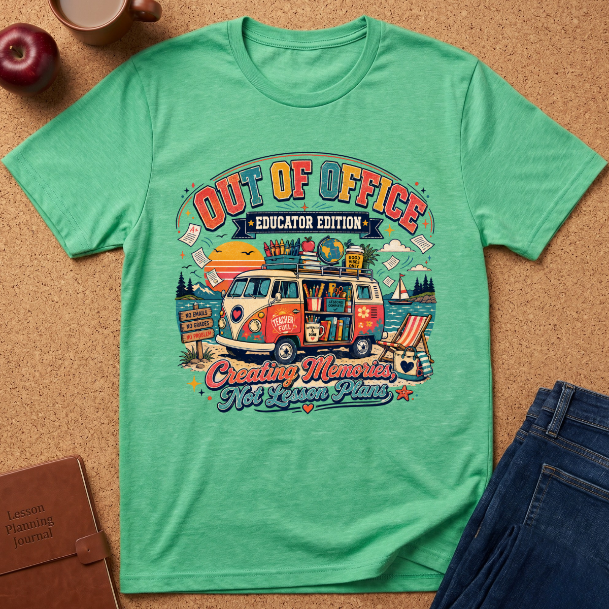 A mint green graphic t-shirt laid flat on a cork background, surrounded by lifestyle props including an apple, a coffee cup, a brown journal, and a pair of blue jeans. The t-shirt features a colorful retro-style illustration of a vintage VW bus loaded with school supplies and books, with the text 'OUT OF OFFICE EDUCATOR EDITION' and 'Creating Memories Not Lesson Plans'.