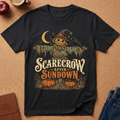 black t-shirt with a Scarecrow in a umpkin patch design that says "Scarecrow after sundown"
