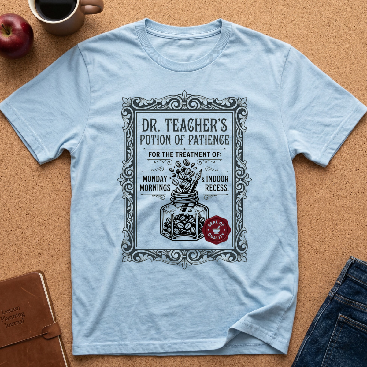 light bue tee with a vintage medicine bottle label showing a bottle of coffee beans, the title reads "Dr Teacher's Potion of paience for the treatment of Monday Mornings & Indoor recess."