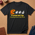Black t-shirt with a funny graphic of a jack o lantern shapped like a pacman chasing 3 scared ghosts, says Powered Up Pasing down late work.  