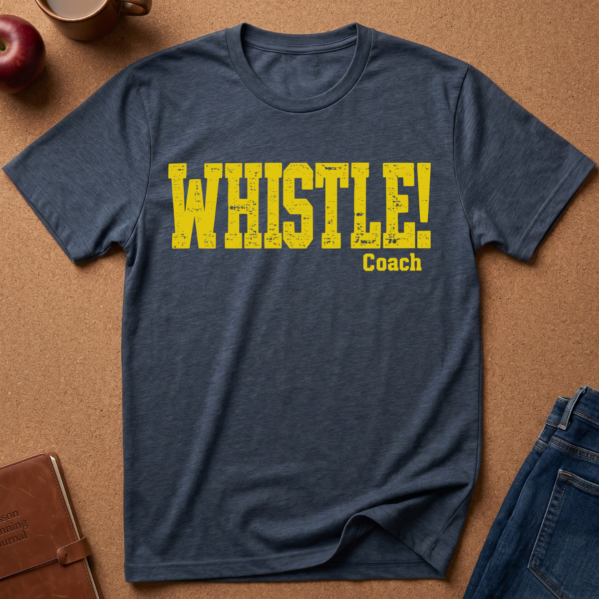 Heather Navy Graphic Tee With the text "WHISTLE!" in a distressed yellow font, and then a second line saying "Coach" in a smaller script.