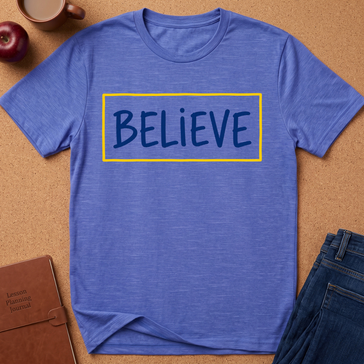  Heather Royal blue Graphic tee wth the text "Believe" in a blue hand drawn font inside a Yellow Rectangle.  