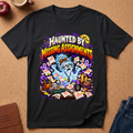 Black Graphic Short Sleeve t-shirt with a Gost surrounded by papers saying late and due yesterday.  Text reads Haunted By Missing Assignments. 