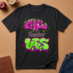 Black t-shirt with colorful text design on a brown surface with a coffee cup and apple. Says Chill teacher vibes.
