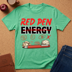 Heather Irish Green graphic t-shirt with 'Red Pen Energy' with '20/50, F minus, No, Fail and X" scattered with a red pen and crumpled paper graphic design on a brown surface with an apple, coffee, and jeans.