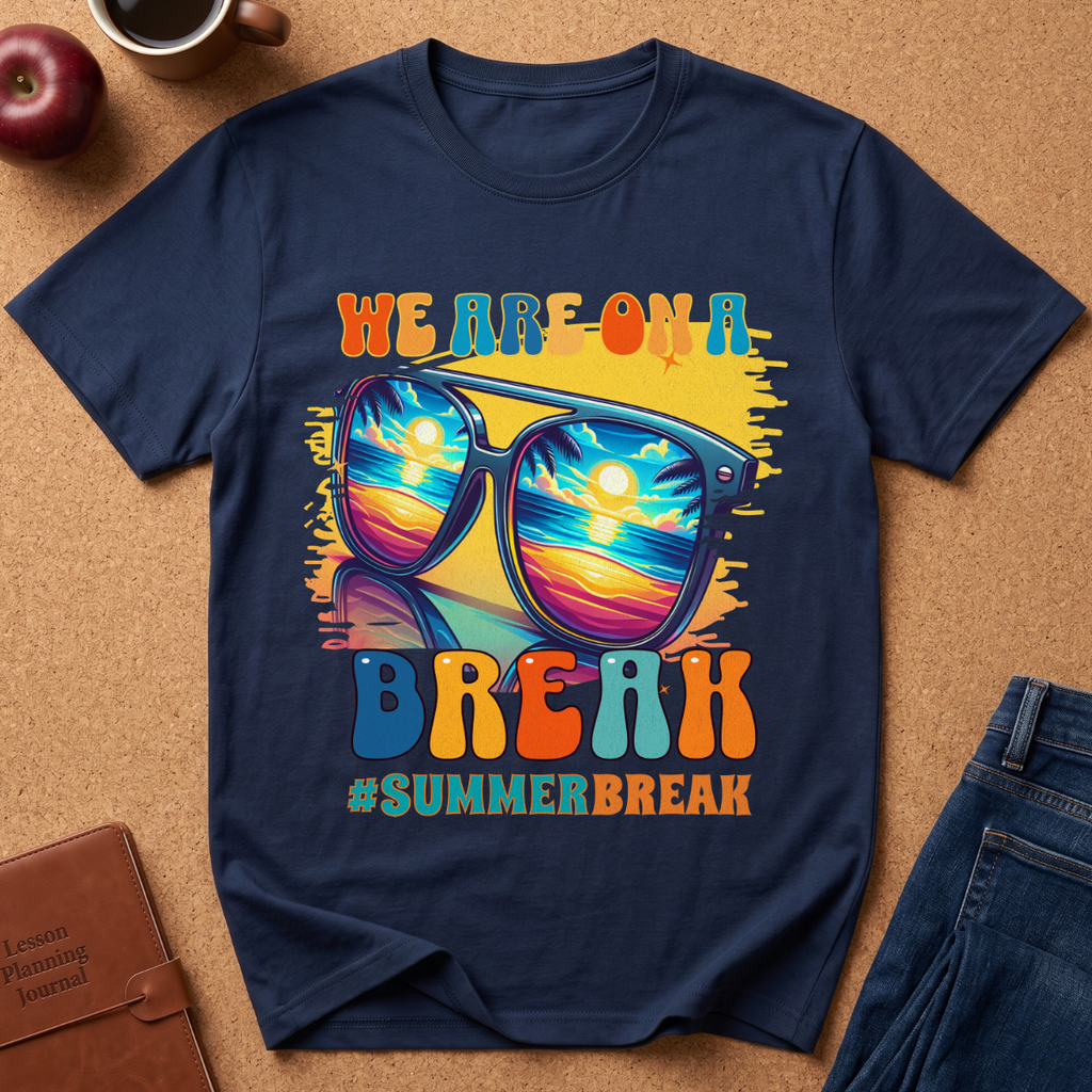 Navy Blue T-Shirt says "We are on a break #SUMMERBREAK" with a graphic image of Sunglasses reflecting a beach sunset.