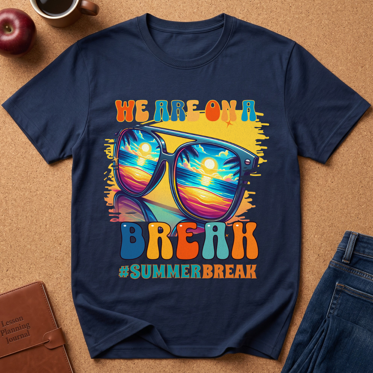 Navy Blue T-Shirt says "We are on a break #SUMMERBREAK" with a graphic image of Sunglasses reflecting a beach sunset.