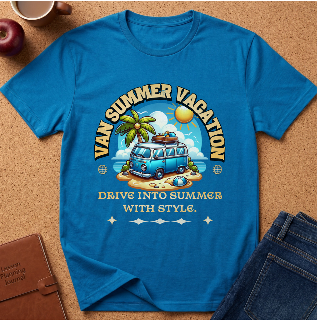 A bright blue graphic t-shirt laid flat on a cork background, featuring a retro-style summer vacation design with a blue van, palm tree, beach, and the text 'VAN SUMMER VACATION' and 'DRIVE INTO SUMMER WITH STYLE.' Styled flat-lay props include an apple, coffee cup, notebook, and jeans.