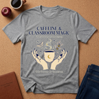 Gray t-shirt with 'Caffeine & Classroom Magic' design on a brown surface with coffee and books.