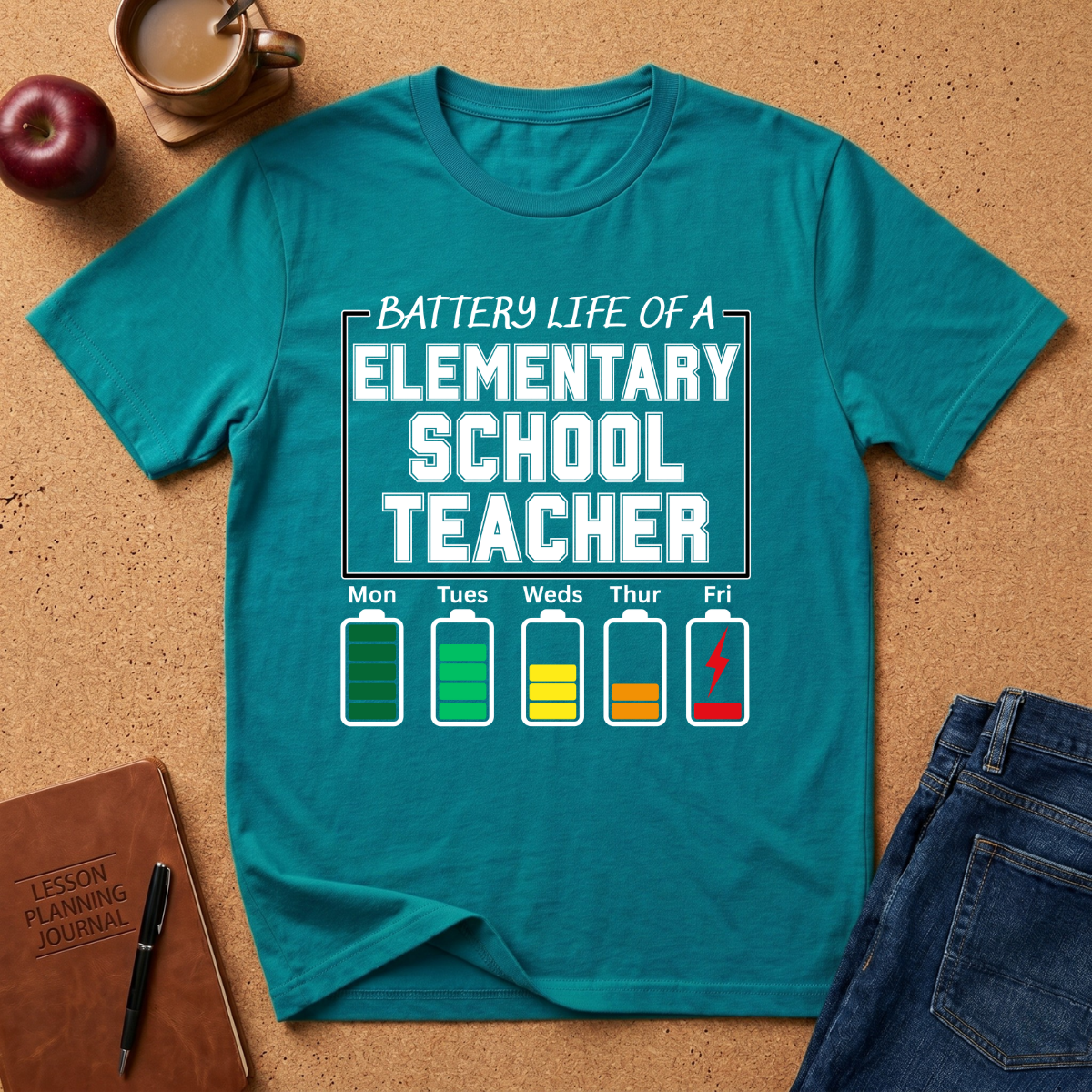 Teal t-shirt with 'Battery Life of a Elementary School Teacher' graphic on a cork background.