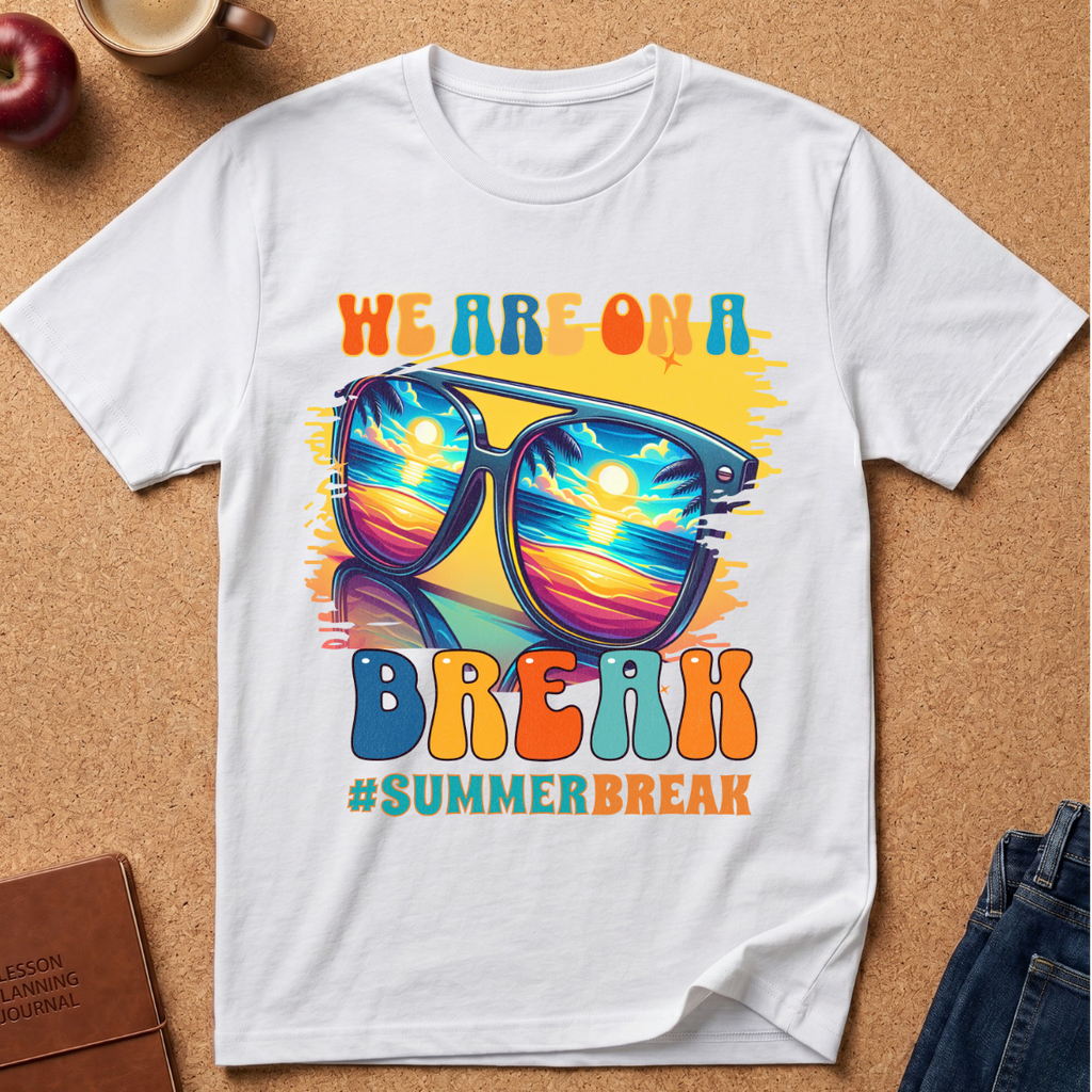 White T-Shirt says "We are on a break #SUMMERBREAK" with a graphic image of Sunglasses reflecting a beach sunset.
