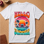 A white short-sleeve T-shirt laid flat on a cork surface, featuring a colorful retro-style graphic with the words “HELLO SUMMER” and a sunset scene with palm trees, birds, and a van.